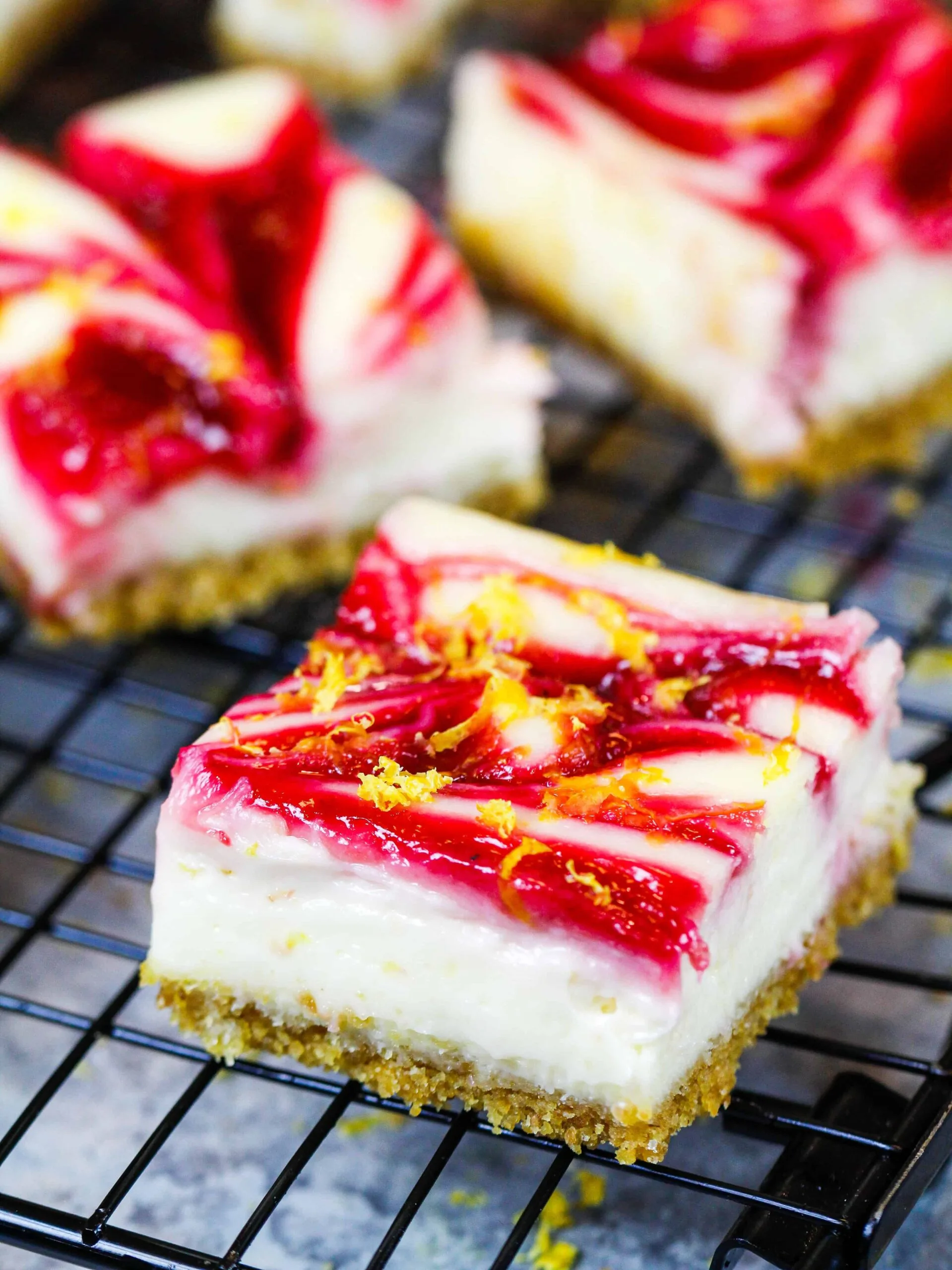 image of lemon cheesecake squares with a raspberry swirl
