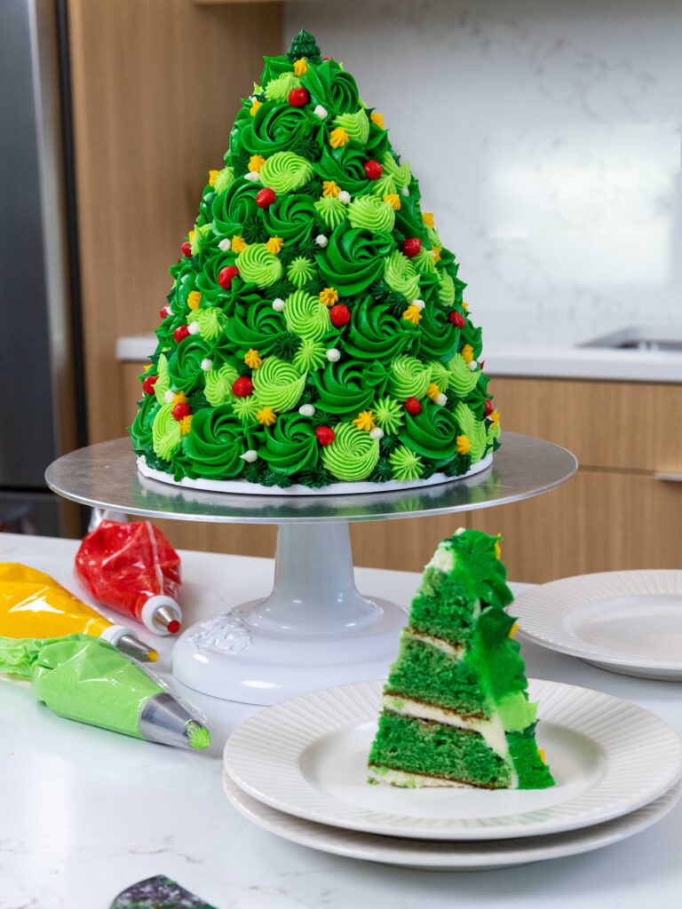 image of a christmas tree cake that's been cut into to show it's cute slice