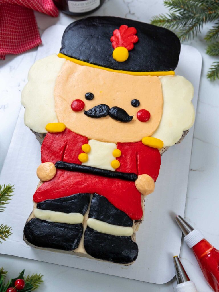 image of a cute nutcracker cake frosted with homemade buttercream frosting