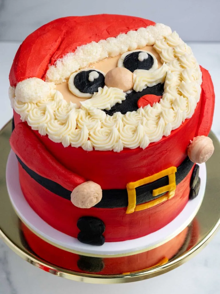 image of a cute santa cake that's been decorated with buttercream