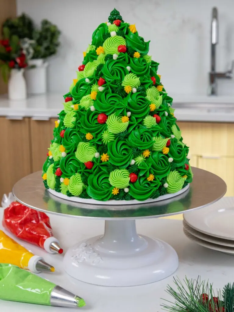 image of a cute buttercream Christmas tree cake
