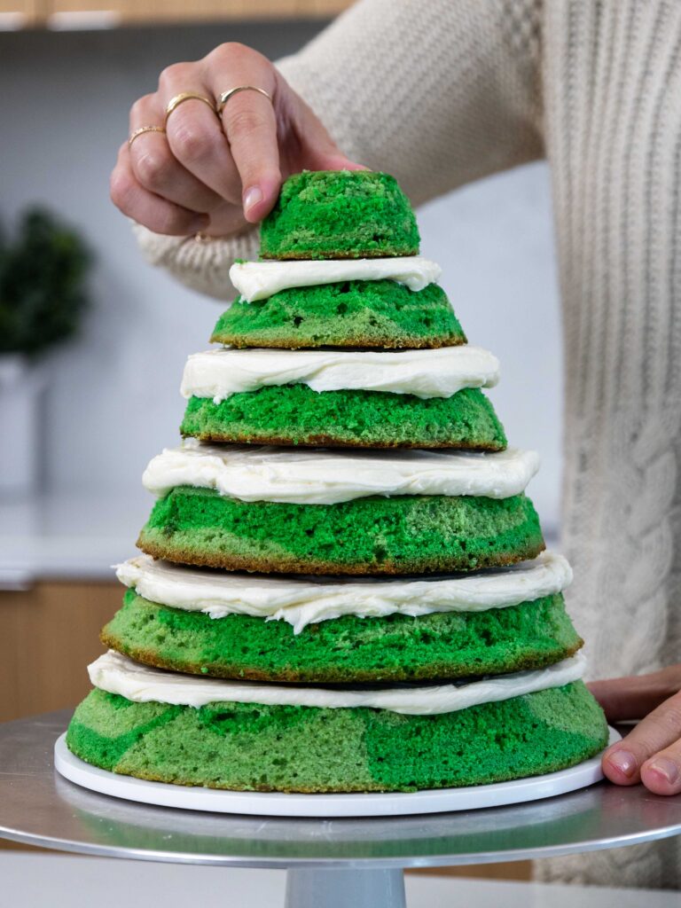 image of green cake layers that have been stacked and frosted with buttercream