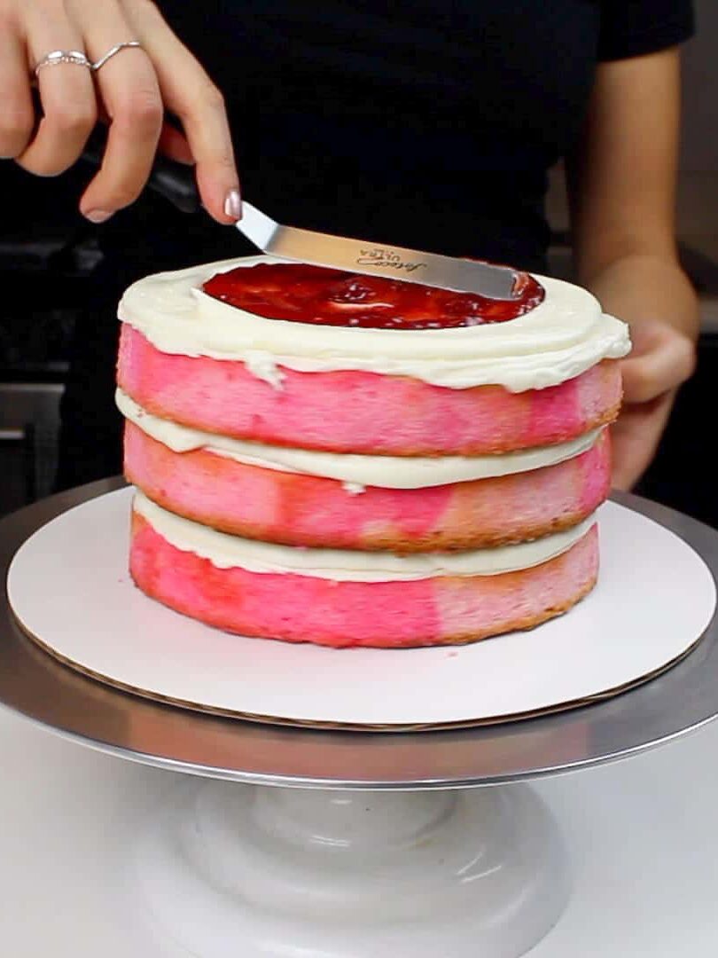 image of adding jam between cake layers