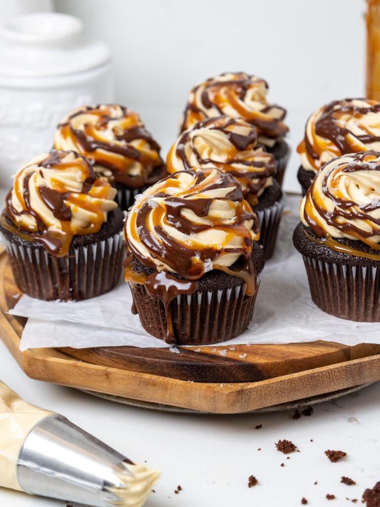 image of a platter of chocolate caramel cupcakes that have been frosted with caramel buttercream