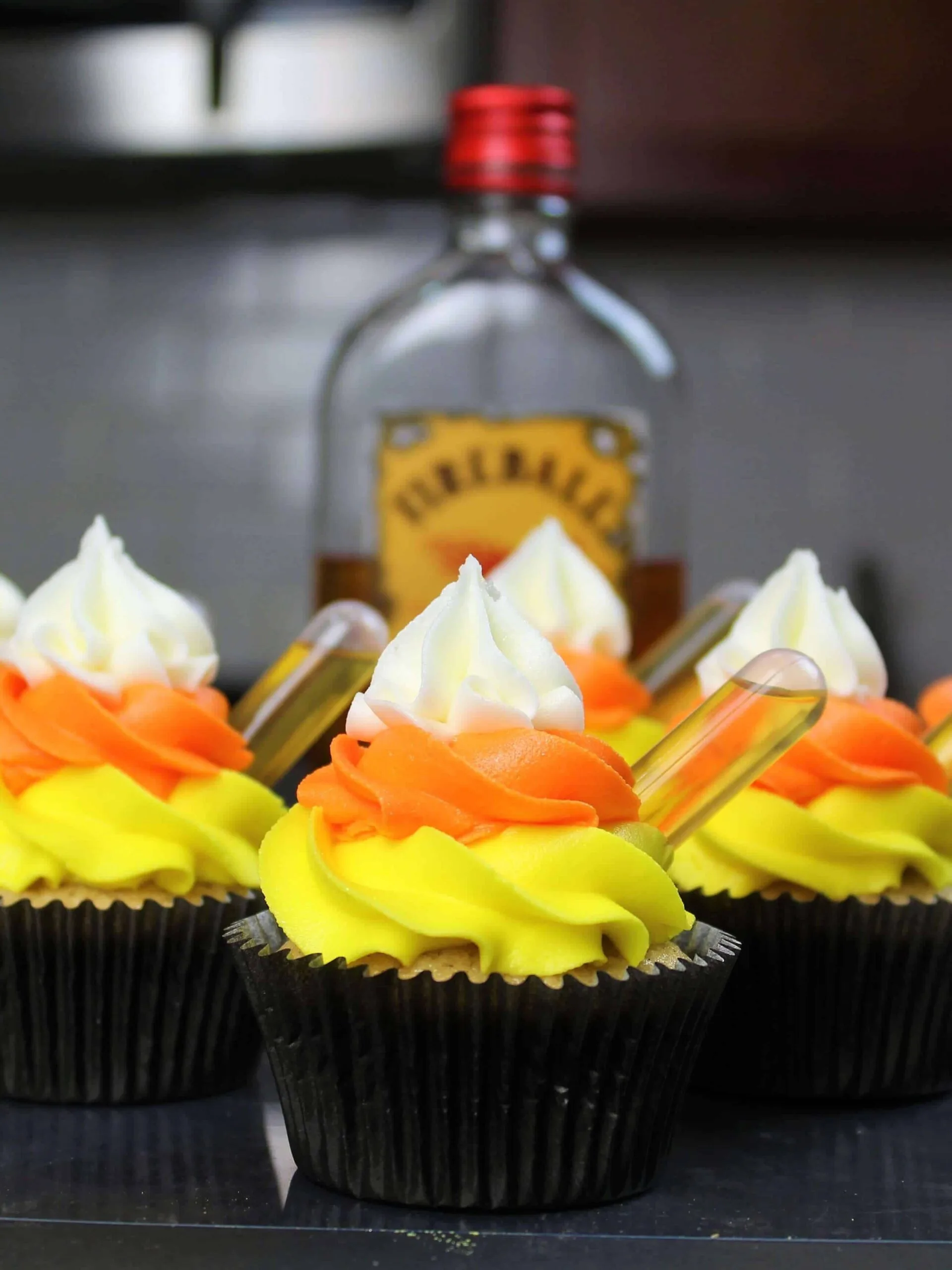 image of whiskey fireball cupcakes that have been frosted with buttercream frosting