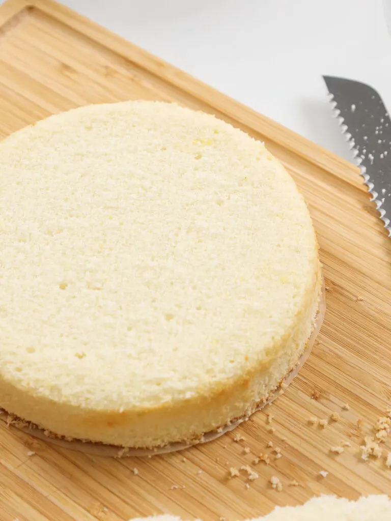 image of a fluffy white cake layer that's been leveled and is ready to be stacked