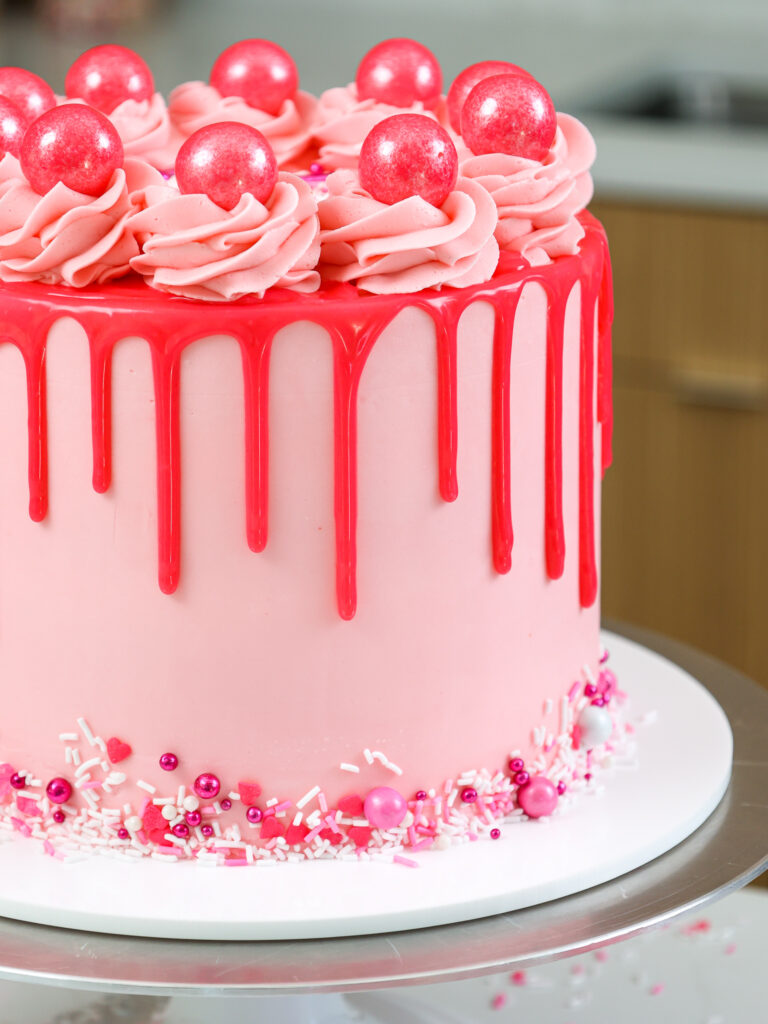 image of bubblegum frosting being piped onto a cake