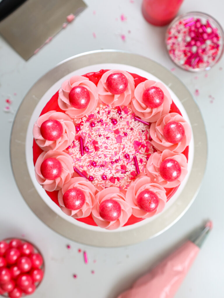 image of a pink bubblegum cake that's been frosted with bubblegum frosting