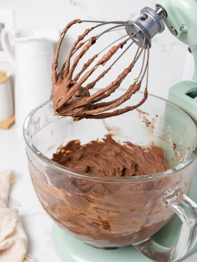image of chocolate whipped cream frosting that's been beat until it reaches medium peaks and can keep its shape