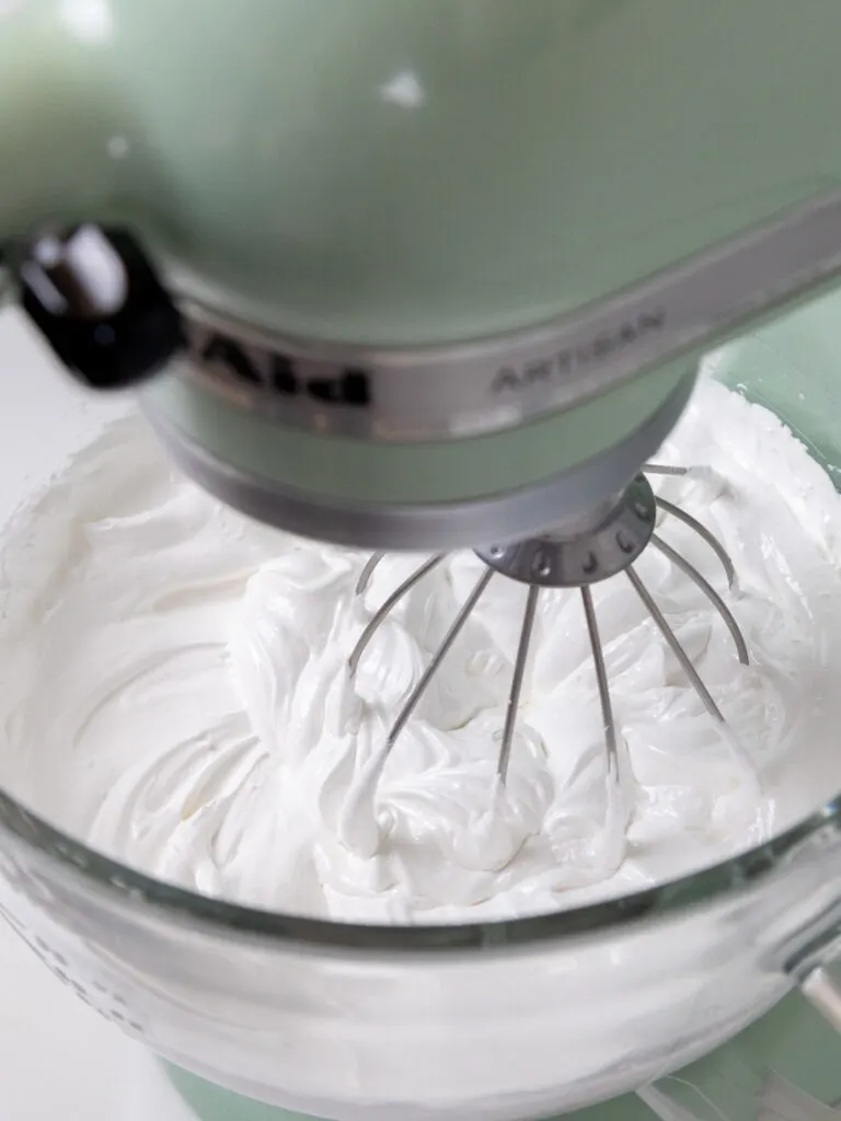 image of Swiss meringue being whipped up in a stand mixer