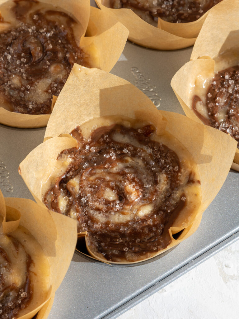 image of nutella swirled banana muffins that are ready to be baked