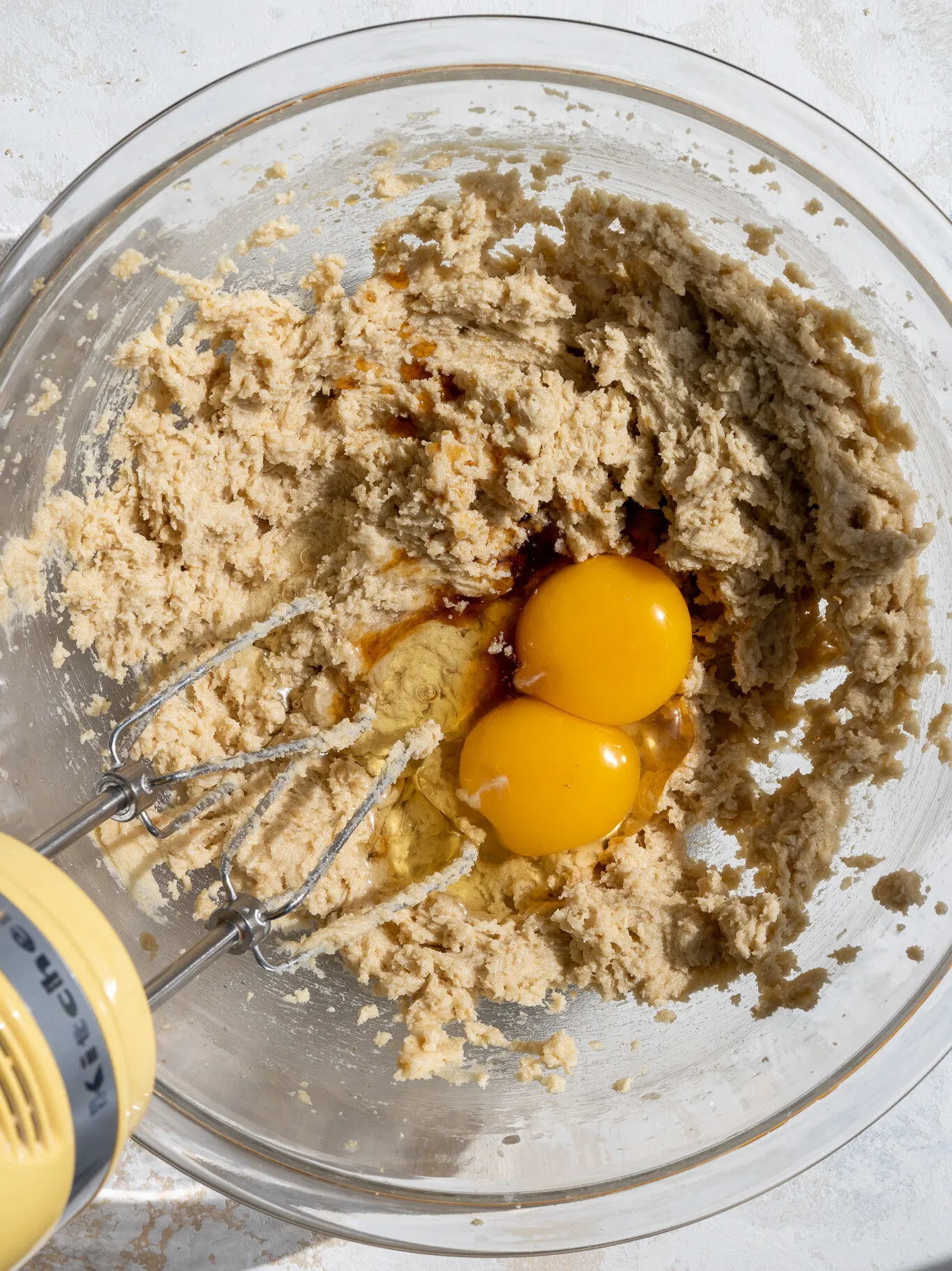 image of eggs being mixed into cookie dough