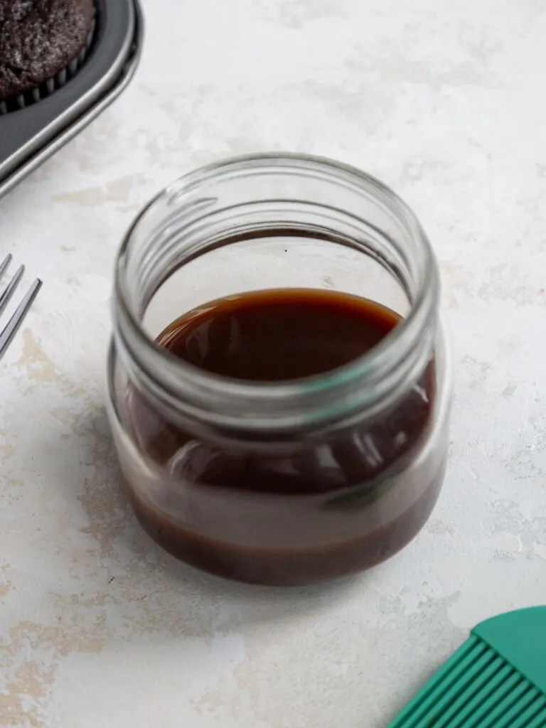 image of a small batch of chocolate simple syrup in a small jar