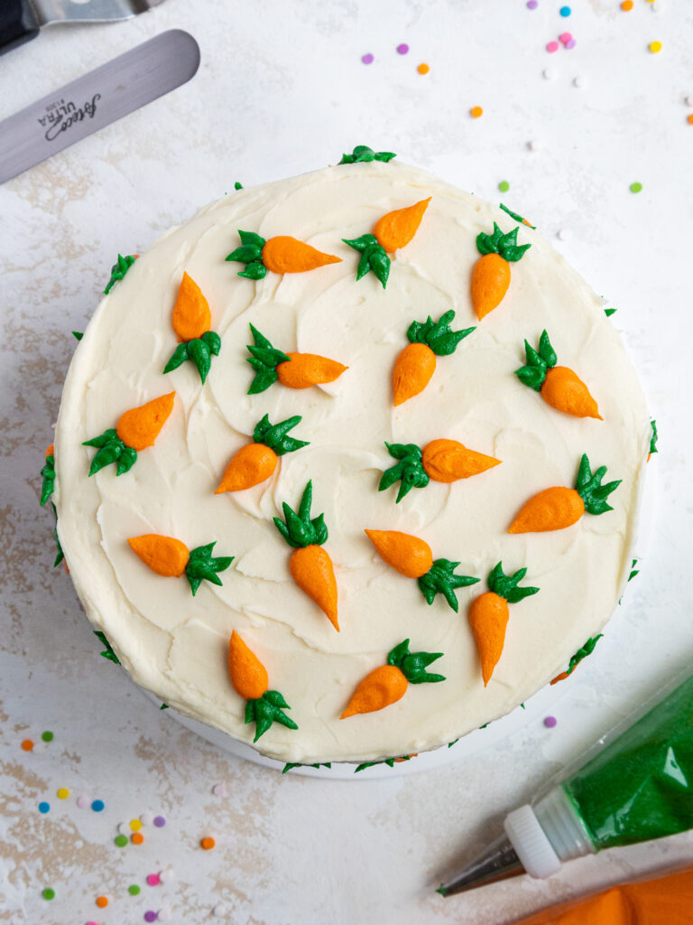 image of a cute carrot cake that's been decorated with little frosting carrots