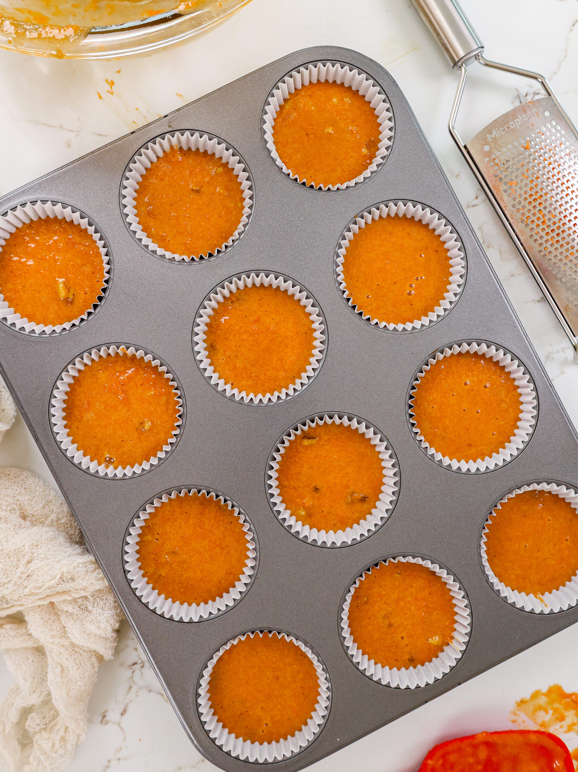 image of carrot cake cupcake batter in a muffin pan