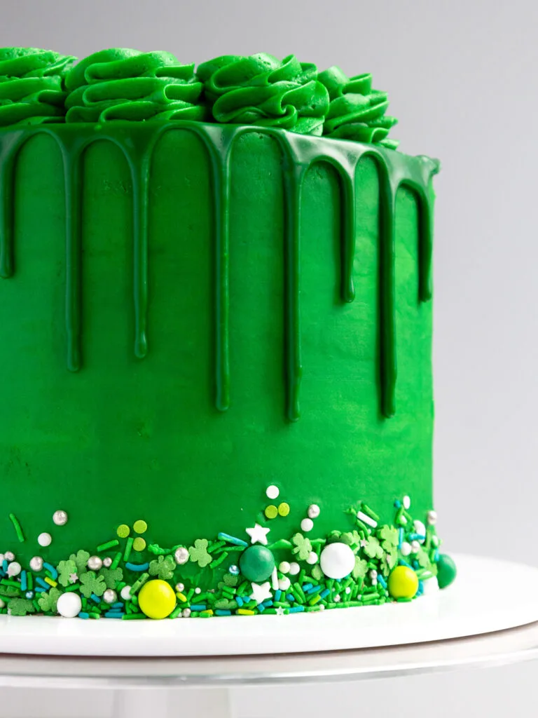 image of a the side of a green drip cake