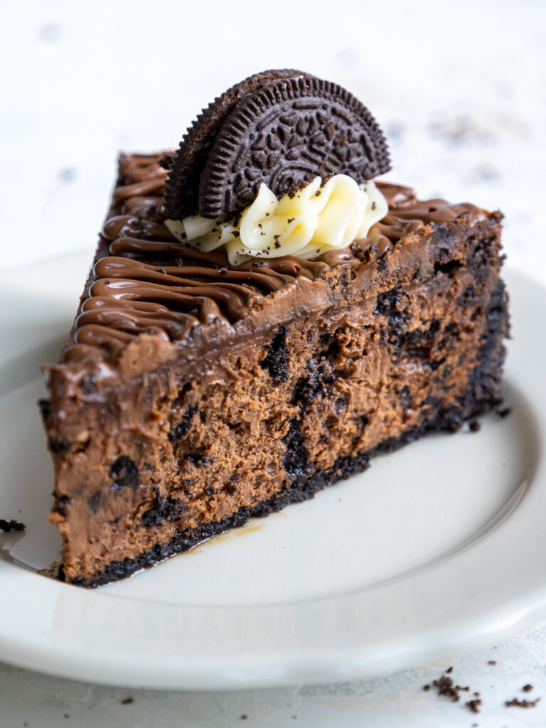 image of a slice of nutella oreo cheesecake on a plate