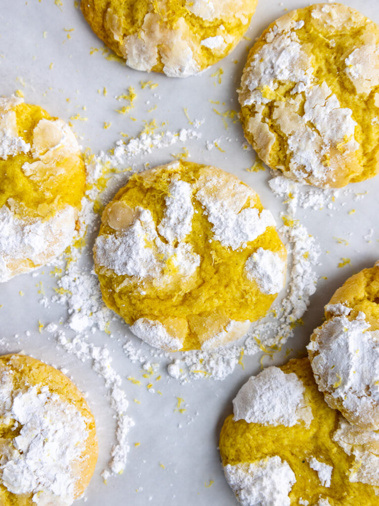 image of lemon crinkle cookies laid out to cool on a wire rack