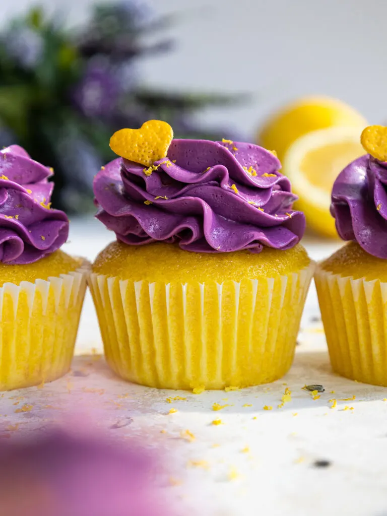 image of lavender lemon cupcakes that are garnished with cute lemon peel hearts