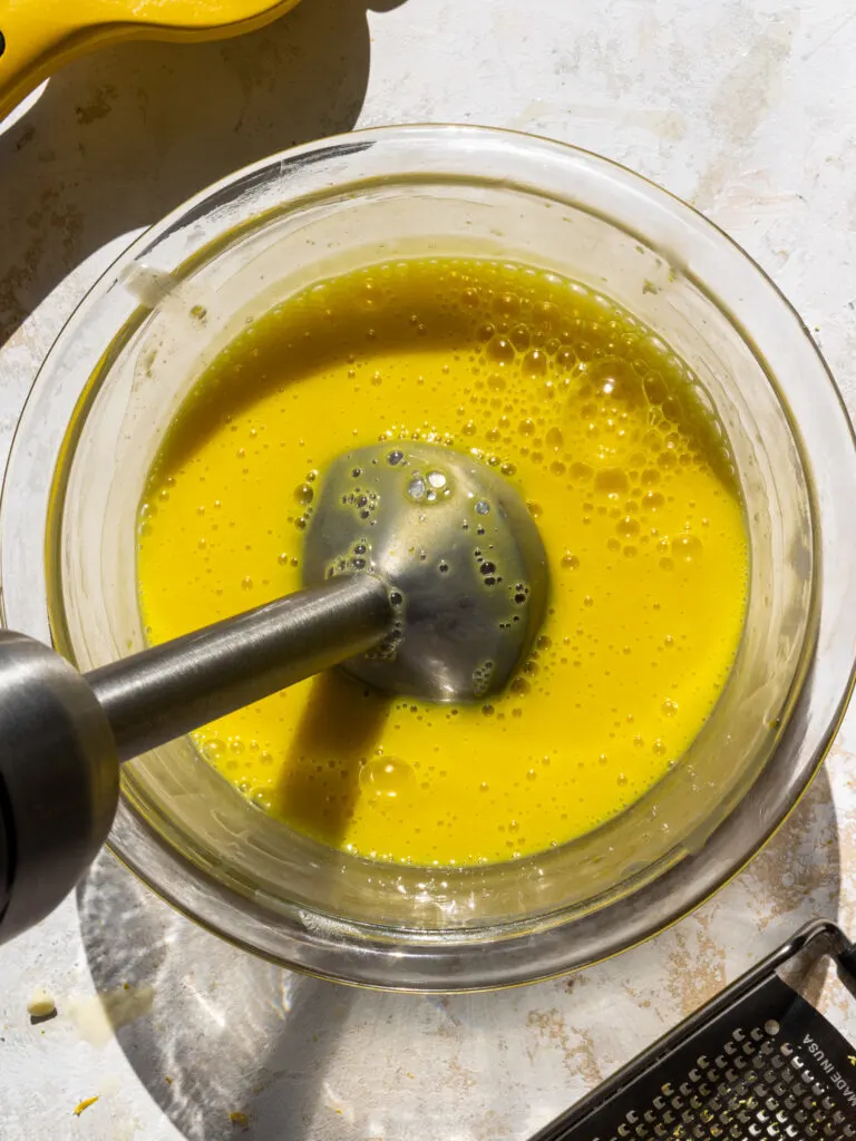 image of an immersion blender being used to make lemon white chocolate ganache