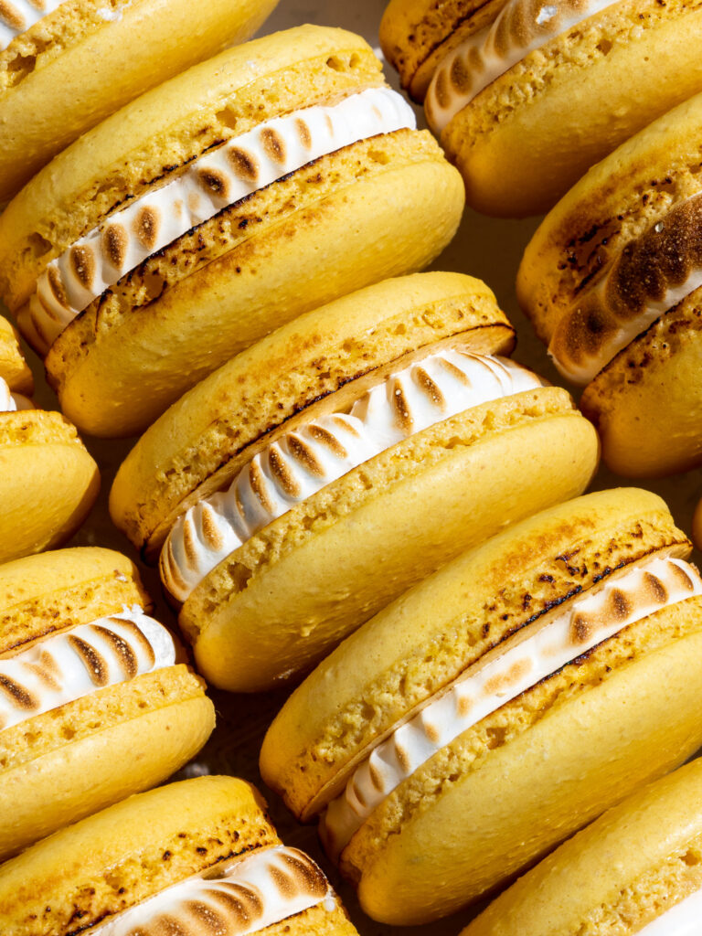 image of lemon meringue macarons that have been stacked together