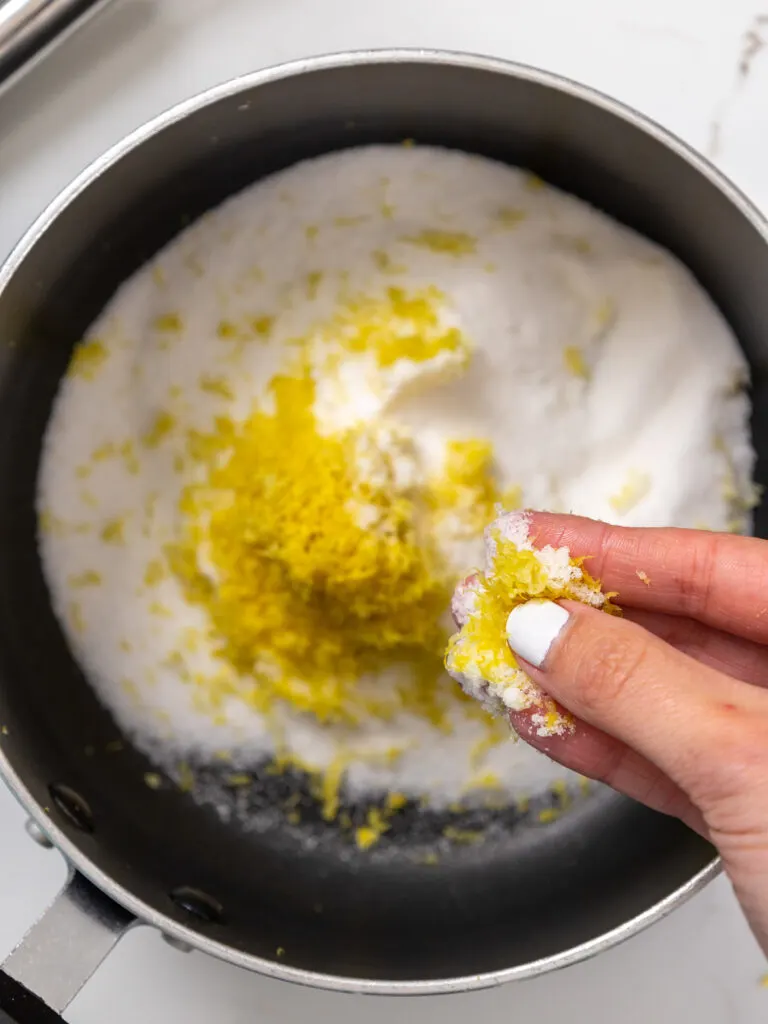 image of lemon zest being massaged into sugar 
