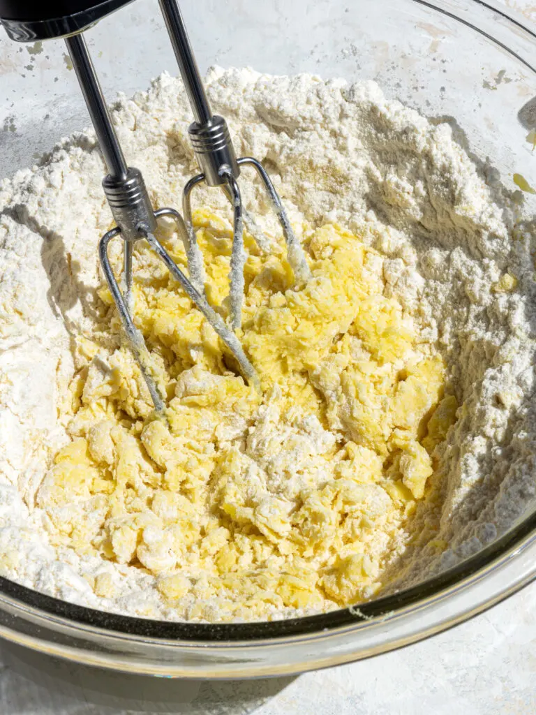 image of dry ingredients being mixed into wet ingredients