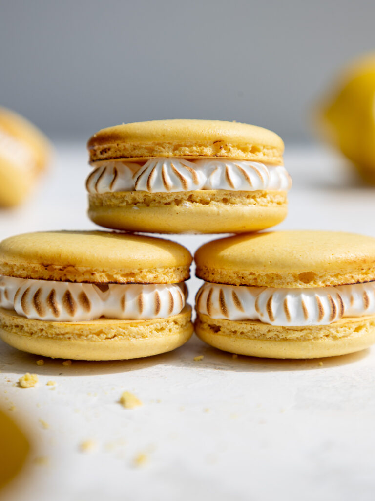 image of lemon meringue pie macarons that have been stacked on each other