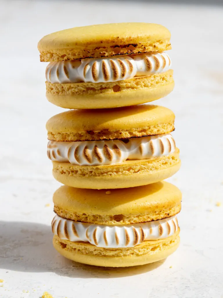 image of lemon meringue pie macarons that have been stacked on each other