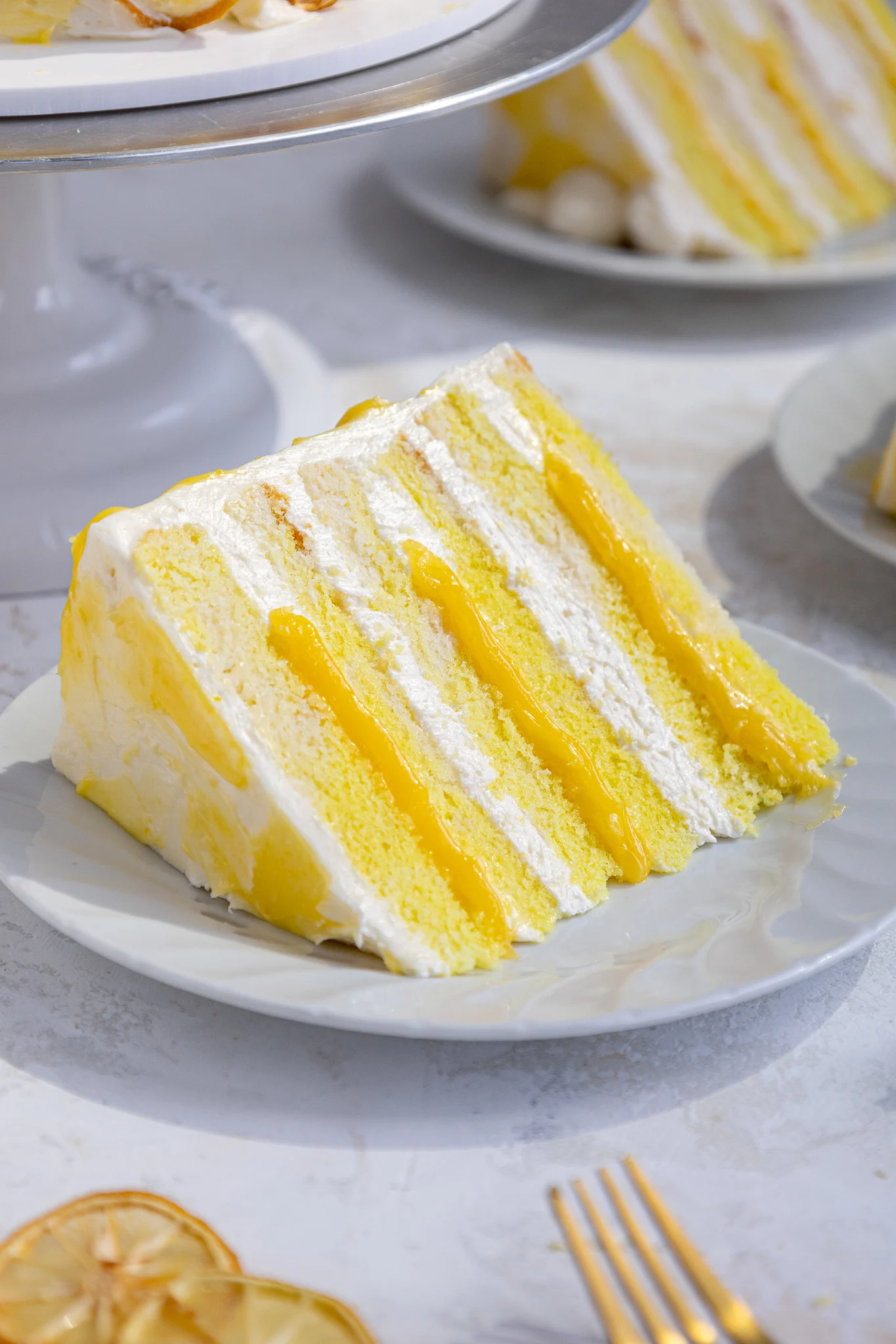 image of a slice of lemon curd cake on a plate