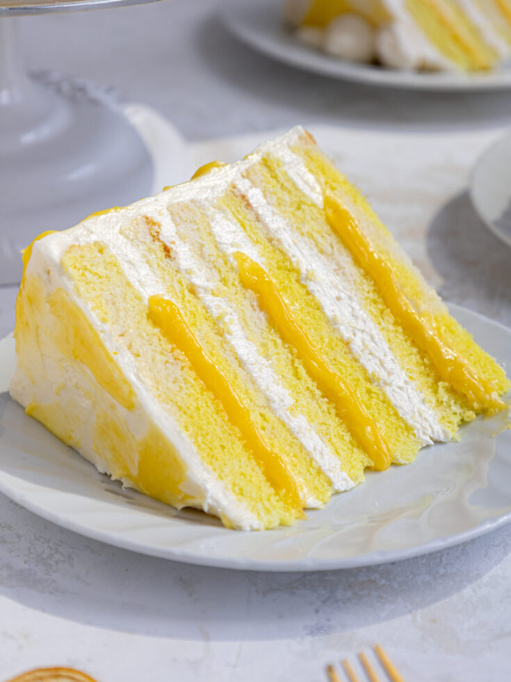 image of a slice of lemon curd cake on a plate