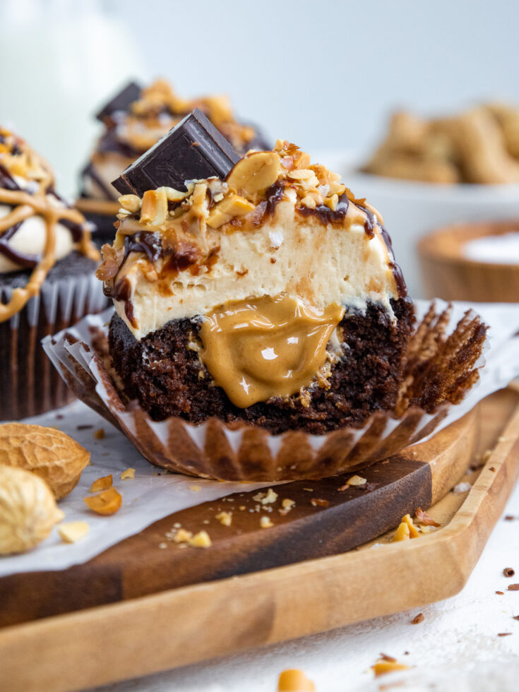 image of a peanut butter filled cupcake that's been cut into to show it's filling