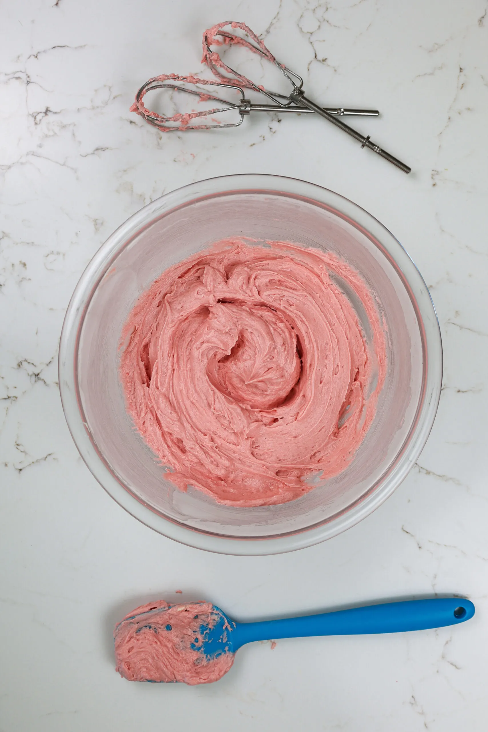 image of strawberry buttercream frosting made with strawberry jam