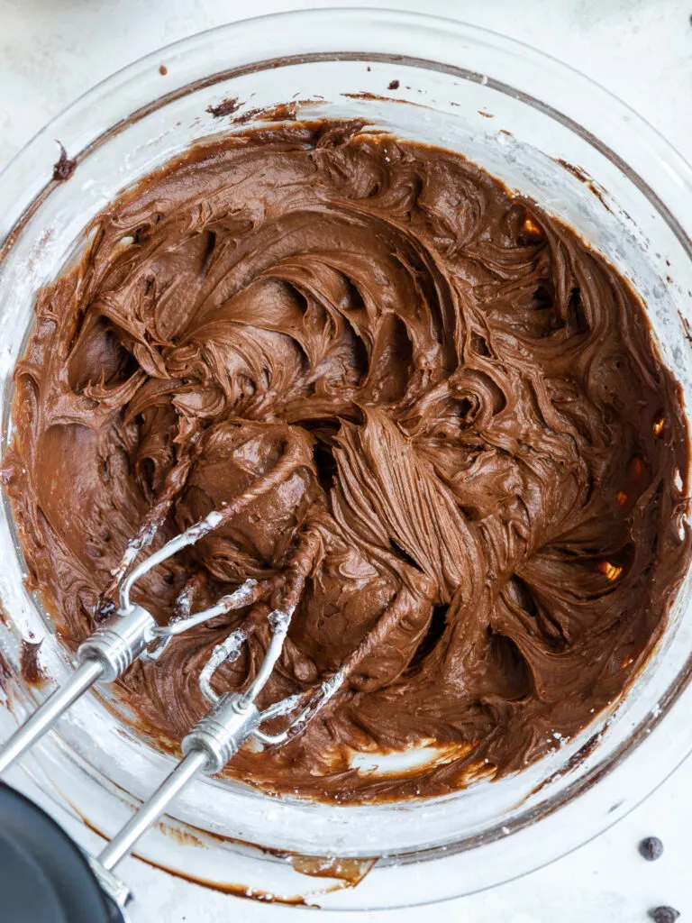 image of chocolate buttercream frosting that's been made with a hand mixer