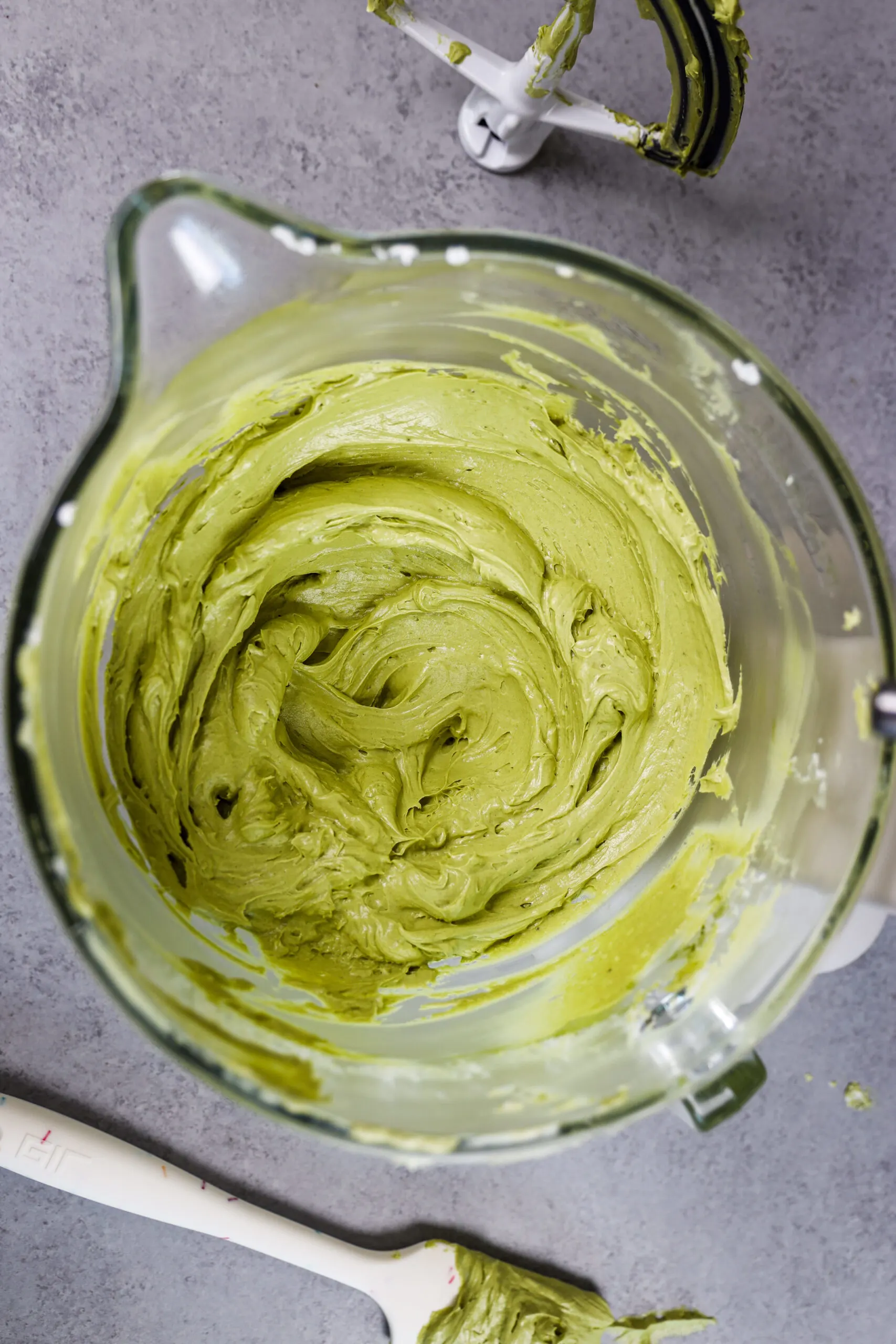 image of matcha buttercream that's been mixed in a large mixing bowl and is ready to be used to frost cupcakes or a cake