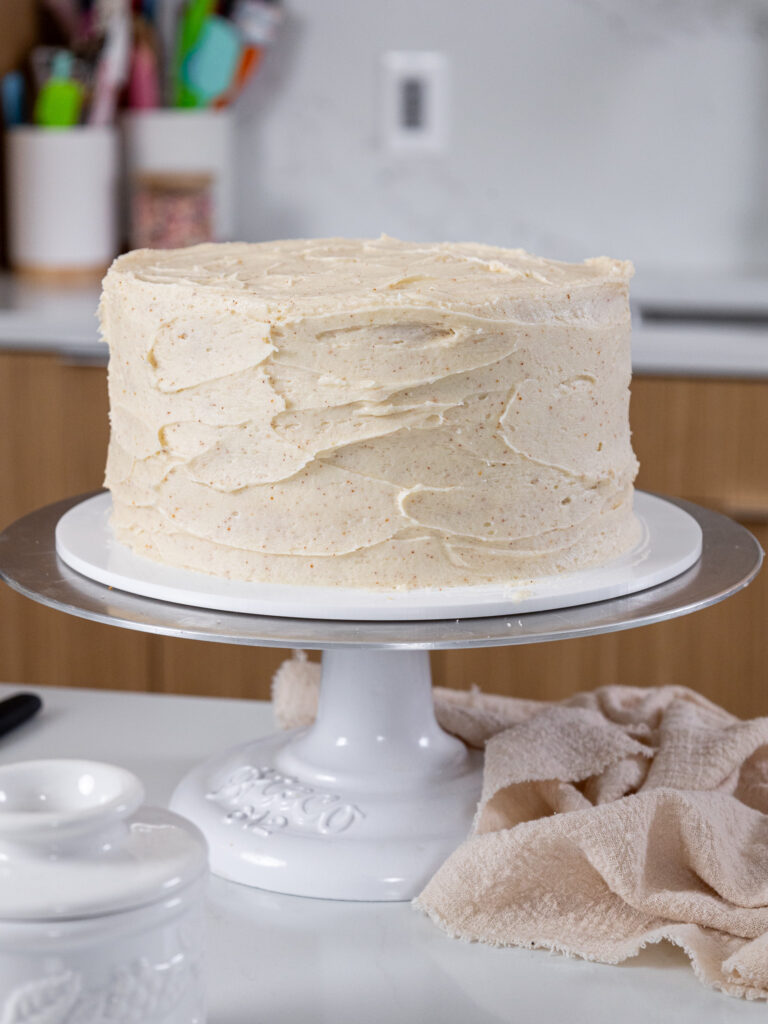 image of a brown butter cake that's been frosted to have a textured look