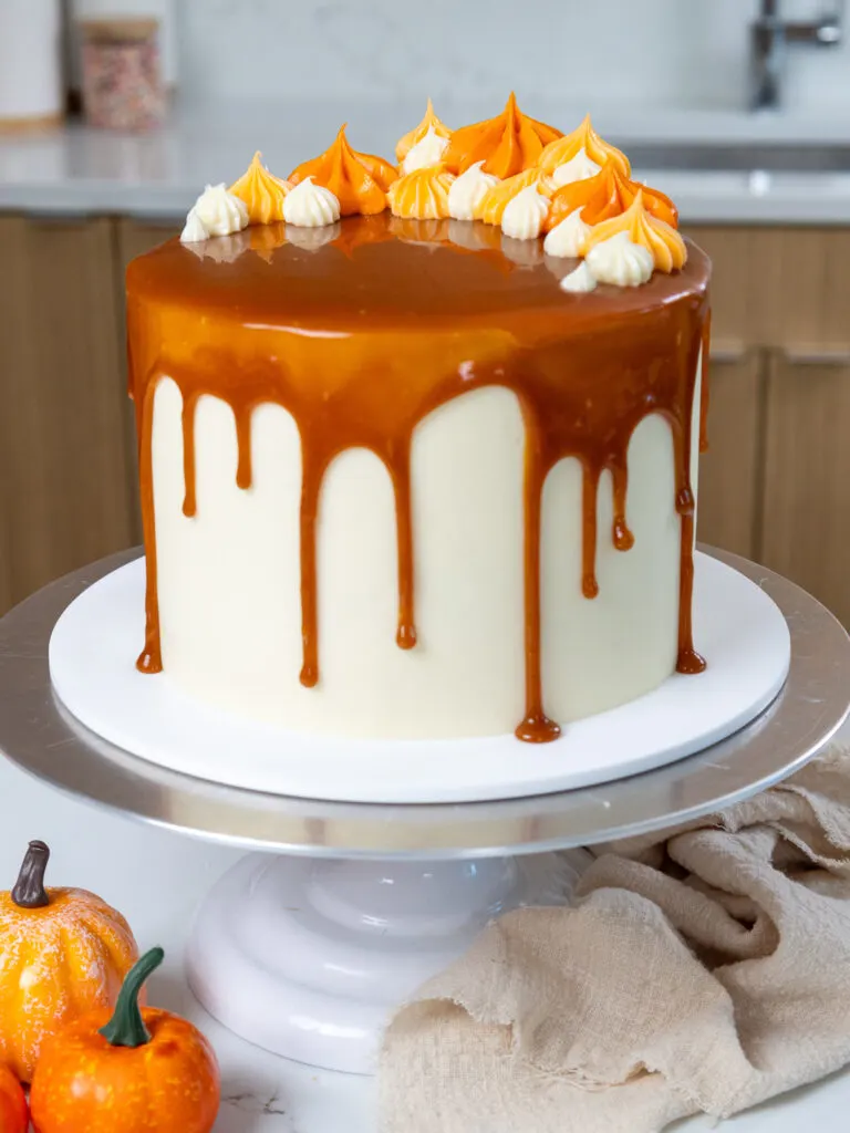 image of an adorable fall inspired pumpkin caramel layer cake