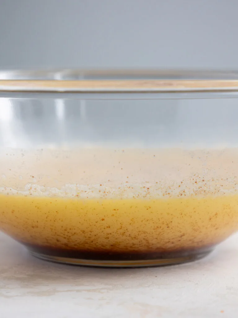 image of brown butter that's been cooled in a glass bowl and has solidified