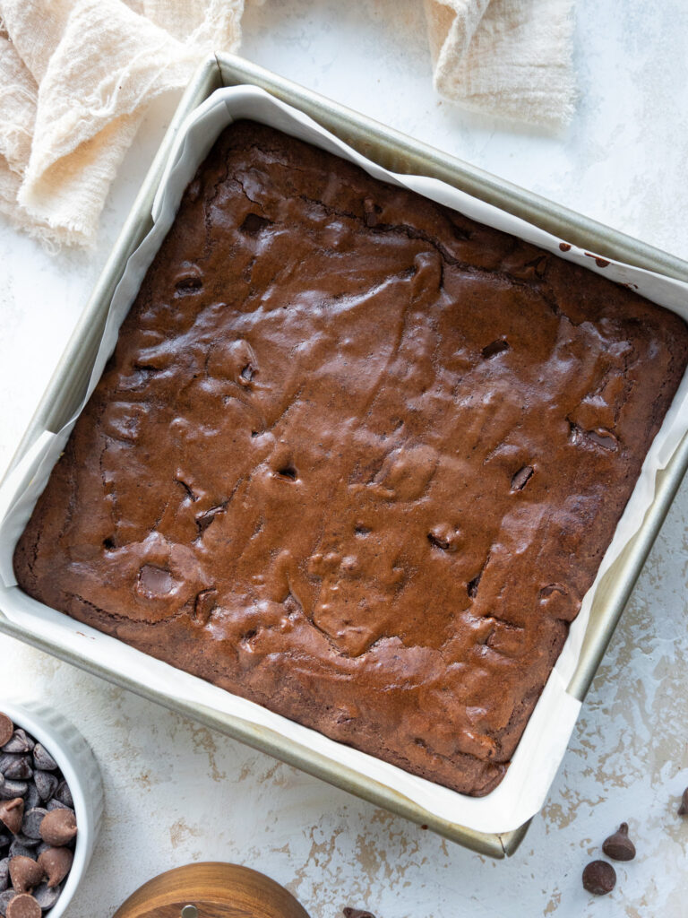 image of baked brownies in a metal pan that are cooling 