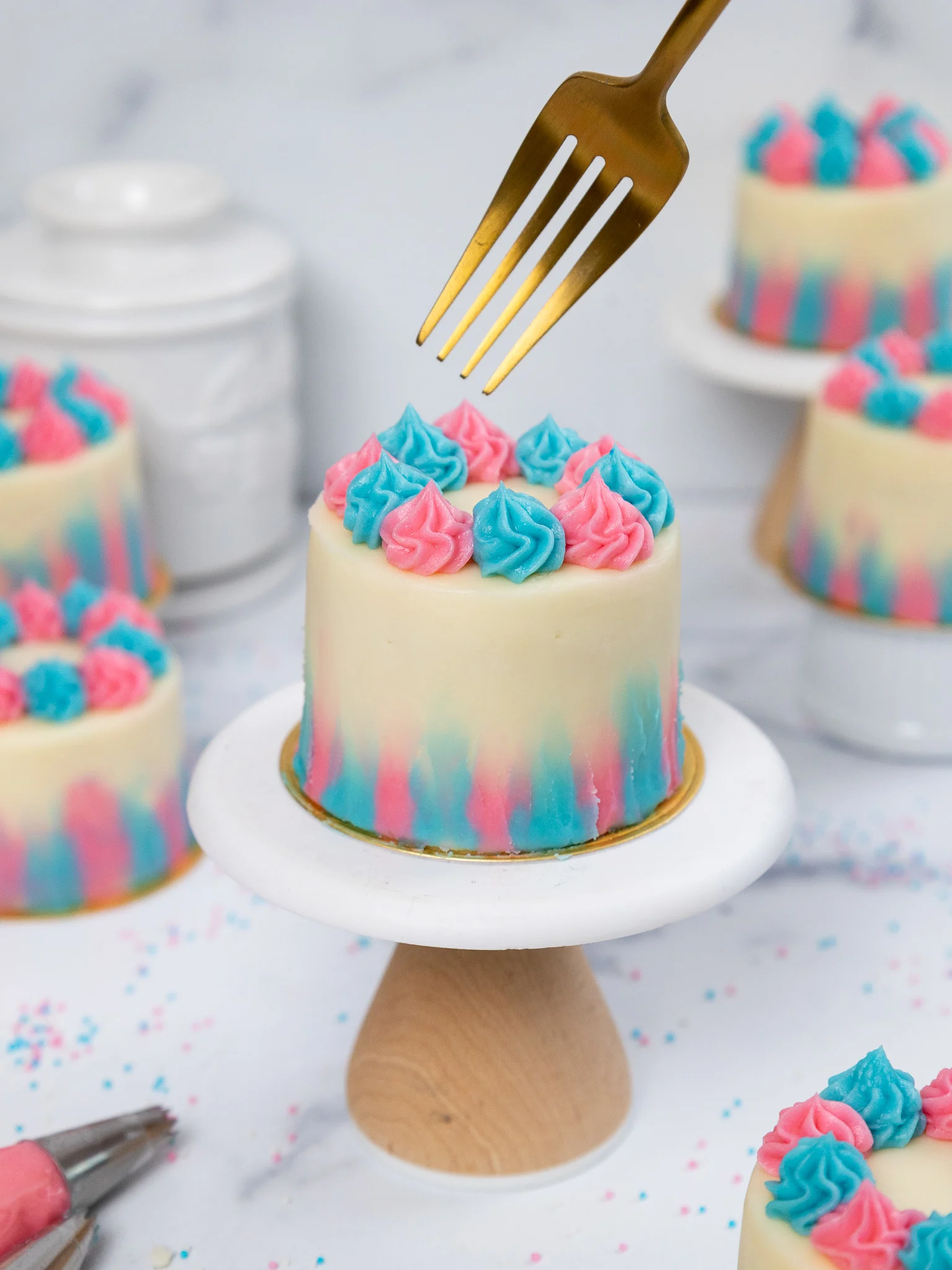 image of a mini gender reveal cake set on a mini cake stand