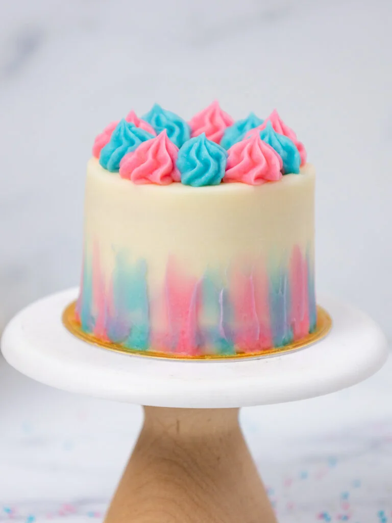 image of a mini gender reveal cake set on a mini cake stand