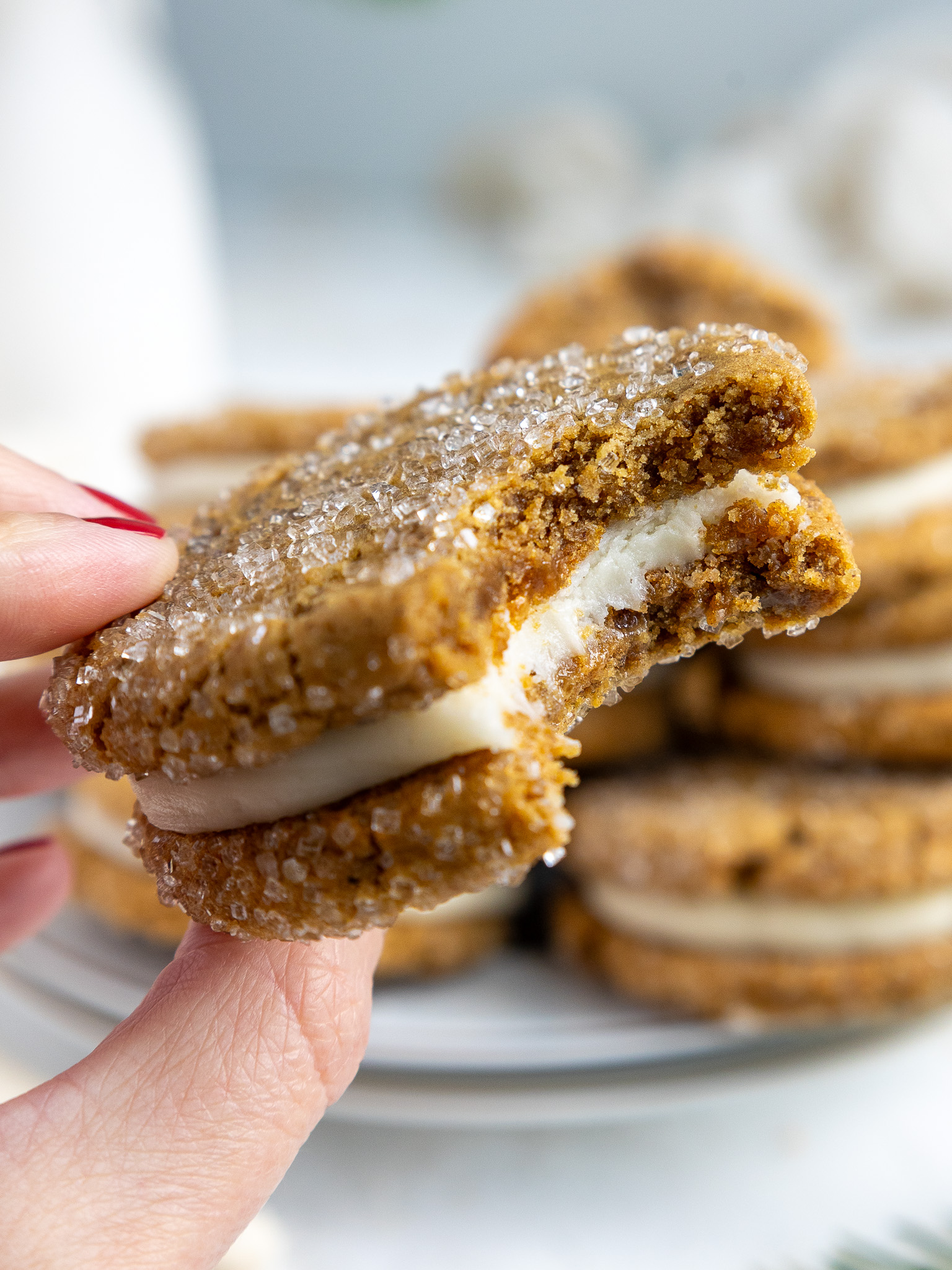 image of a gingerbread sandwich cookie that's been bitten into to show how soft and chewy it is