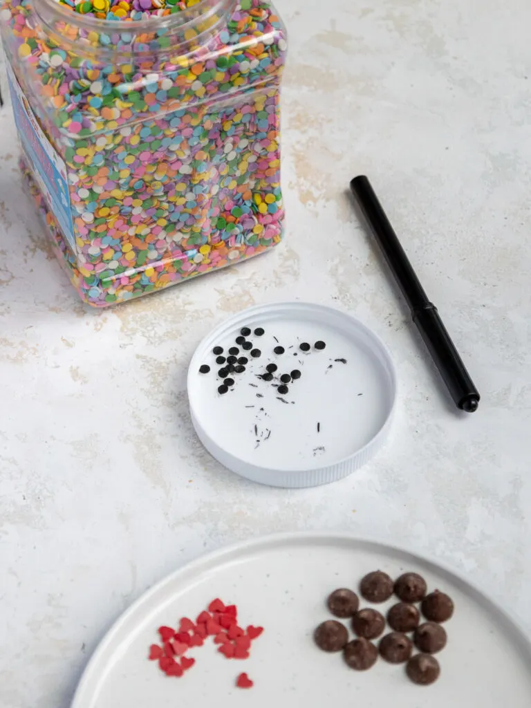 image of sprinkles laid out to decorate polar bear cookies