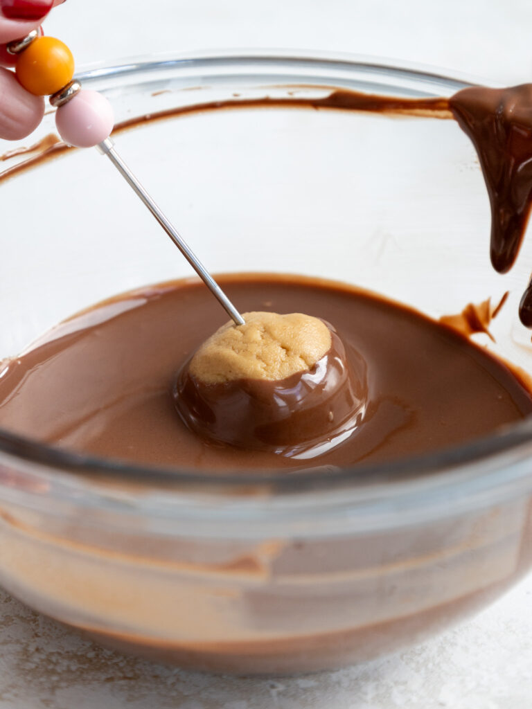 image of a buckeyes being dipped in chocolate