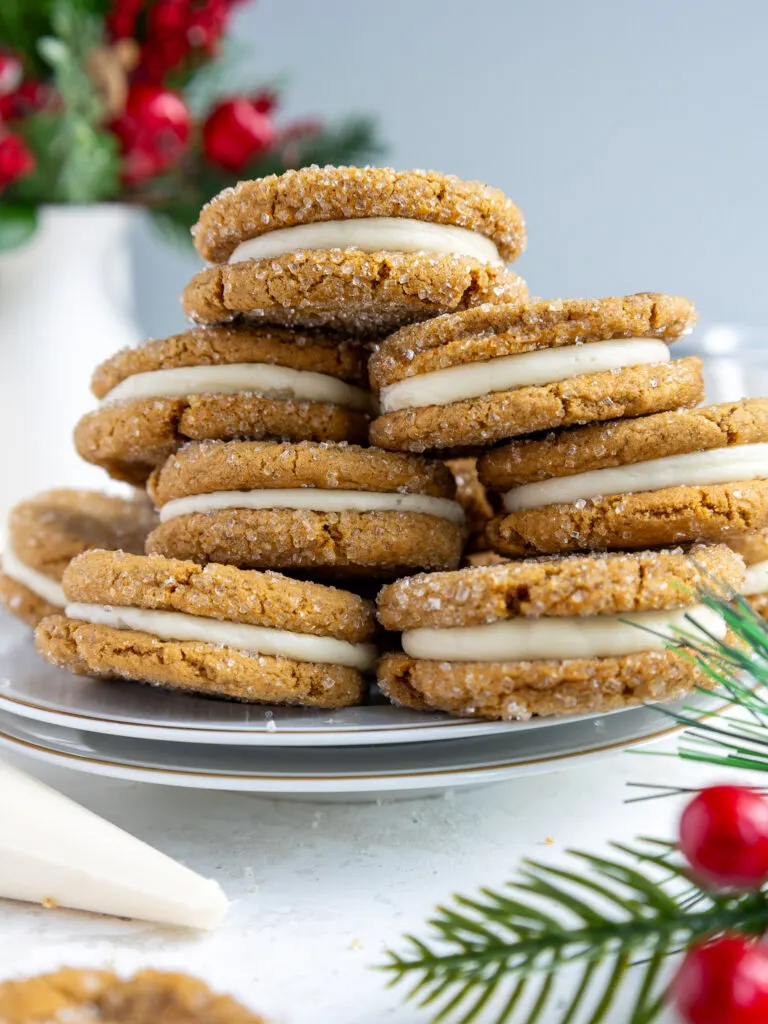 image of a stack of gingerbread sandwich cookies piled high on a plate