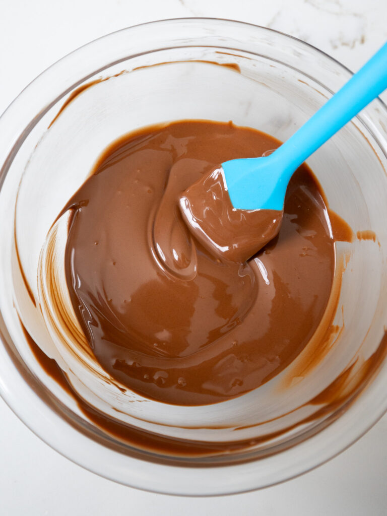 image of milk chocolate that's been melted down with shortening to make a chocolate coating for buckeyes
