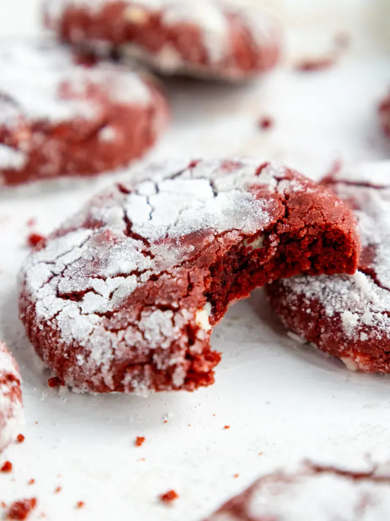 image of a red velvet crinkle cookie that's been bitten into