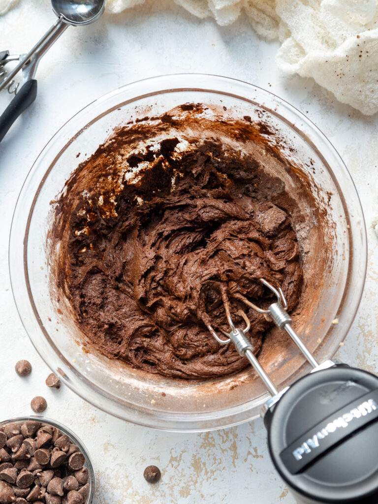 image of double chocolate cookie dough  being mixed in a bowl