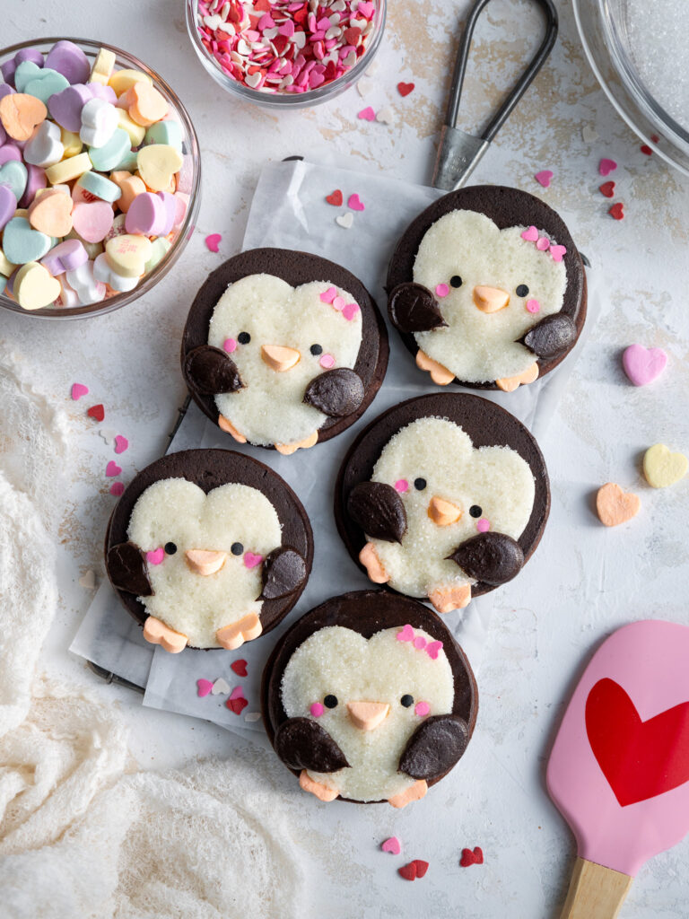 image of cute penguin cookies that have been decorated with buttercream frosting