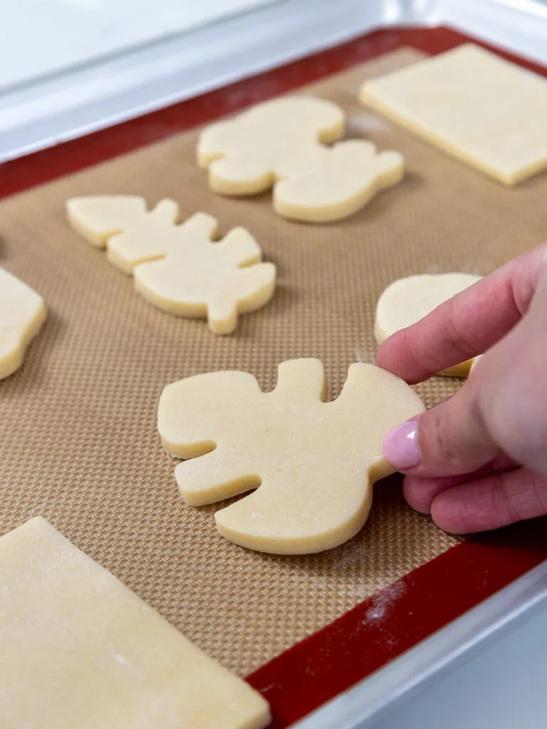 image of sugar cookies being placed on a baking sheet